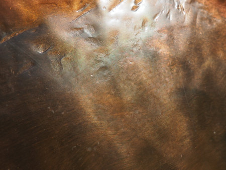 Metal bronze textured plate. Bronze or copper polished surface with dents, scratches and...