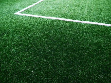 The marking of the football field on the green grass. White lines no more than 12 cm or 5 inches wide. Football field areaの写真素材