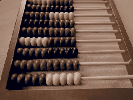 Education concept - abacus with many colorful beads. details on the abacus. Mathematical exercises. School program.の写真素材