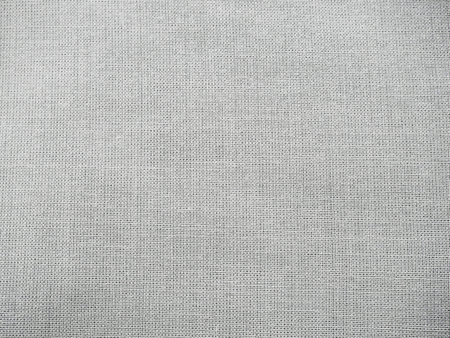 Texture canvas fabric as background. Gray sackcloth. Grey linen scrim.の写真素材