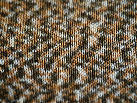 Knitted or crochet canvas. Knitting in style - knitted gum. White, gray, brown, beige threads. A ripple pattern. Machine viscous.の写真素材