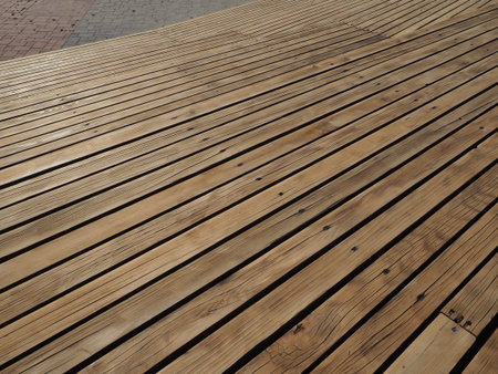 The background is made of polished and lacquered boards with nail hats. Brown beautiful wood....