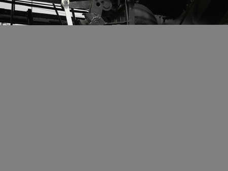 Retro train two wheels. Sleepers and rails, mechanisms, pistons and guides. Locomotive of the 19th early 20th century with a steam engine. Black and white wheels with green grass. Vintage styleの写真素材