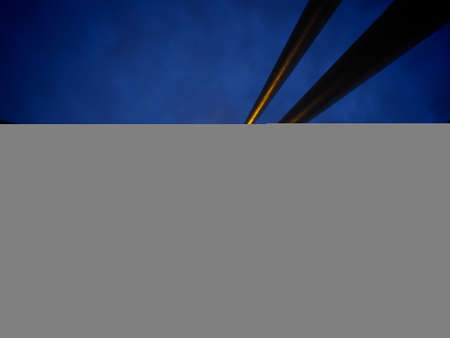 Searchlights on the bridge. Portable LED light tower. St. Irenaeus Pedestrian Bridge over the Sava...