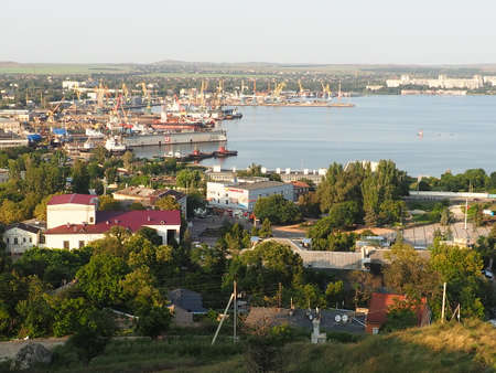 Kerch August 21, 2021 View of the city of Kerch from the observation deck on Mount Mithridat. Houses, trees, Black and Azov seas, seaport. Cove and opposite shore with horizon. Summer eveningのeditorial素材