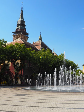 Subotica, Serbia, September 12, 2021. Fountain on the square of Subotica between the City Hall, the building of the National Theater and the City Library. Jets of clean water, splashes and dropsのeditorial素材