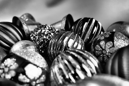 Christmas flat lay with Xmas decorations and holiday beautiful balls. Christmas tinsel. Happy New Year and Merry Christmas. Black and white monochrome photo. Still life background.の写真素材