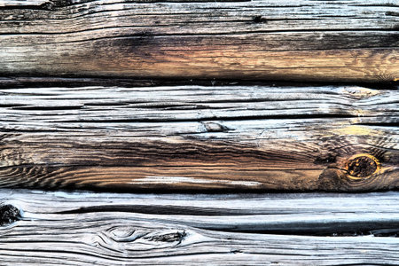 Background horizontal logs. Wooden background from shabby boards and logs. Round lumber assortment....