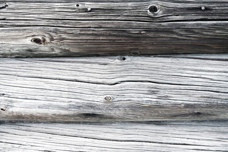 Background horizontal logs. Wooden background from shabby boards and logs. Round lumber assortment....