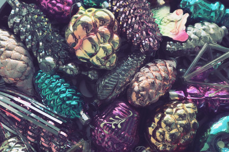 New Year and Christmas tree decorations, glass balls in the form of cones and baskets. Cones and...