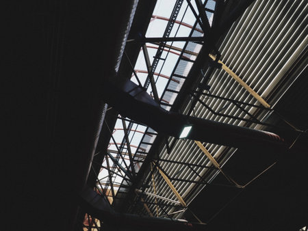 The roof of a hangar, a production hall or a sports hall. Metal structures, beams, supporting...