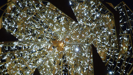 New Year and Christmas illumination of city streets. Flashing, flickering, shining, gleaming of...