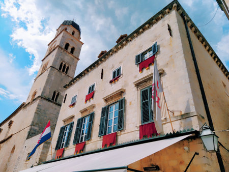 Stradun, Stradone is the main street of the historic city center of Dubrovnik in Croatia. architectural sights. A popular place for tourist walks. August 14, 2022 Tower and facades of ancient houses.のeditorial素材