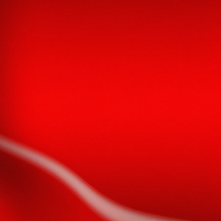 Red abstract gradient background with dark and light stains and smooth linesの写真素材