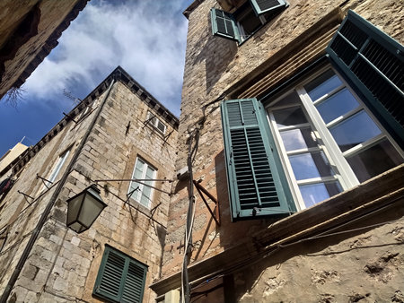 Dubrovnik, Croatia, August 14 2022 Streets of the old town. The facades of the houses are made of...