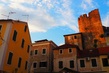 Herceg Novi, Montenegro, 08.10.2022 center of the old city, ancient buildings. Summer evening, golden hour. Square Trg Nikole Djurkovica, Trg soli.のeditorial素材