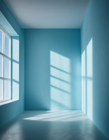 Blue wall and large window. Sunlight is streaming through window, casting long shadows on wall. Room is bright and airy, with clean, minimalist feel. Background for interior or product display.の素材