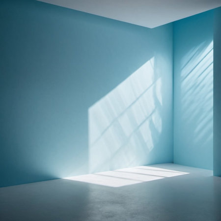 Blue wall and large window. Sunlight is streaming through window, casting long shadows on wall. Room is bright and airy, with clean, minimalist feel. Background for interior or product display.の素材