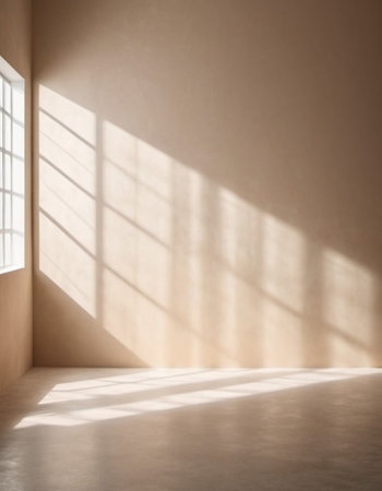 Beige wall and large window. Sunlight is streaming through window, casting long shadows on wall. Room is bright and airy, with clean, minimalist feel. Background for interior or product display.の素材
