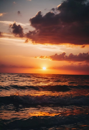 The warm glow of the setting sun casts golden hues over the tranquil waves of the ocean, creating a serene atmosphere by the shoreline during dusk. Sunset or sunrise at sea. Romantic landscape. AI.の素材