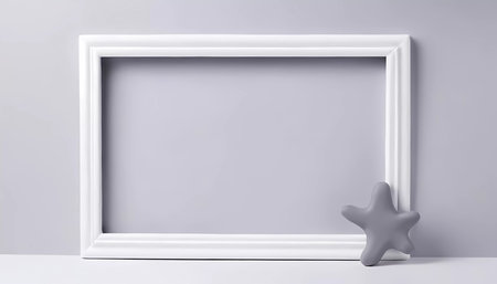 A rectangular frame is positioned in front of a white gray abstract background. A soft gray star-shaped object rests on the floor beside the frame, creating a minimalistic display.の素材