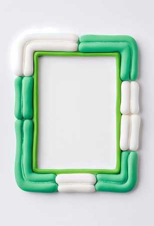 The rectangular frame features an abstract design made of green and white molded materials, providing empty space for artistic expression or decoration.の素材