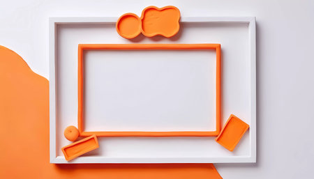 Bright and vibrant, this workspace highlights a rectangular white frame surrounded by playful orange shapes, inviting creativity and design ideas in a minimalist setting.の素材