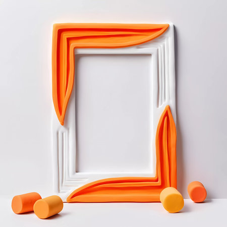 This uniquely designed rectangular frame features a white and orange color palette, offering an empty space perfect for artistic display and creative interpretation in any setting.の素材