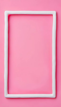 A rectangular frame crafted from play dough rests on a vibrant pink backdrop, creating a perfect setting for creative expression or artistic endeavors.の素材