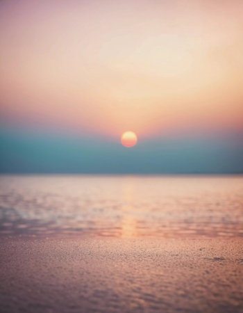 A breathtaking sunset unfolds as pastel colors merge in the sky, casting a serene glow over the still waters of the sea. The tranquility invites calm contemplation and awe.の素材