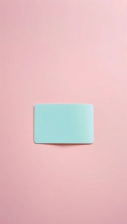 A soft pastel card lies gracefully on a smooth pink surface, highlighting the beauty of minimalism. The gentle hues invite calm and creativity, evoking serene vibes.の素材