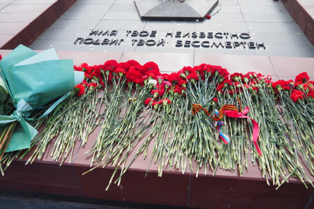 The eternal flame is a constantly burning fire, the solemn memory of the people about the fallen heroes, freedom fighters. Inscription - your name is unknown, your feat is immortal.の写真素材
