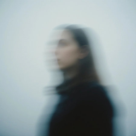 A blurred figure stands against a pale backdrop, creating an eerie atmosphere. The scene evokes feelings of ghostly presence and haunting mystery.の素材