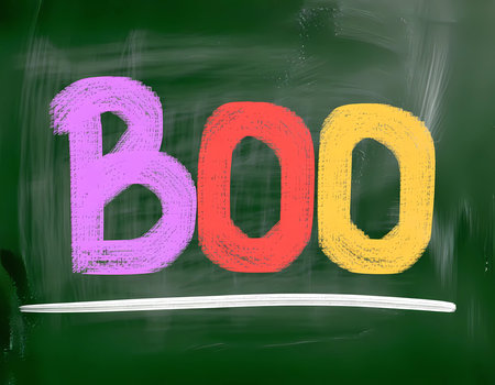 Bright letters spell out Boo in purple, red, and yellow on a chalkboard, creating a playful Halloween atmosphere perfect for decorations or celebrations.の素材