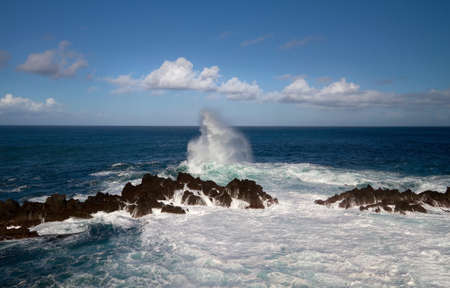 Waves breaking on Madeiras north coast.の写真素材
