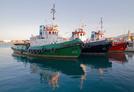 Three tugboats in harbor.の写真素材