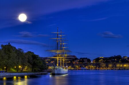 Old ship in moonlight.の写真素材
