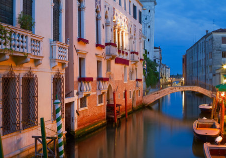 Magnificent buildings at a canal in Venice at night のeditorial素材