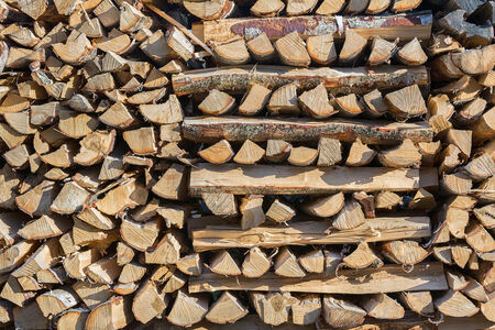Pile of chopped wood stored for winter の写真素材
