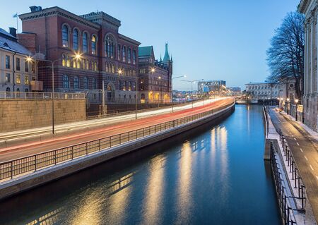 Light trails from traffic passing through city at night.の写真素材