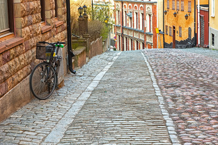 Bike parked on picturesque street in the city.の写真素材