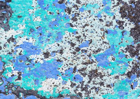 Closeup of a blue green and white stone wall.の写真素材