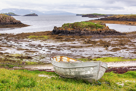Fishing boat on Icelandic shore in summer.の写真素材