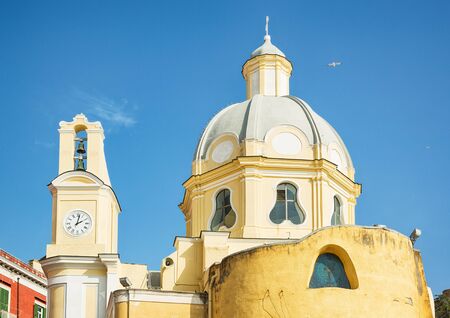 Yellow sunlit church in Italy.の写真素材
