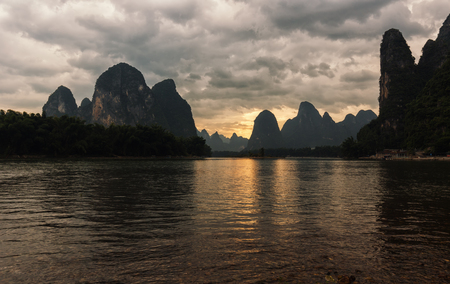 Sunset on Li river in China, beautiful karst landscape.の写真素材