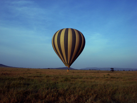 Hot air balloon over fieldsの写真素材