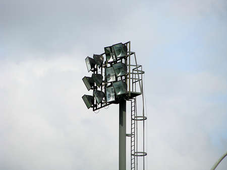 Stadium lights against blue sky backgroundStadium lights against blue sky backgroundの写真素材