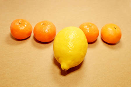 group of Mandarin and a lemon making a differenceの写真素材