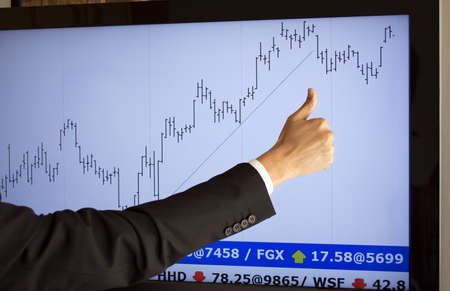 stockbroker giving approval a purchase  fictitious market data の写真素材