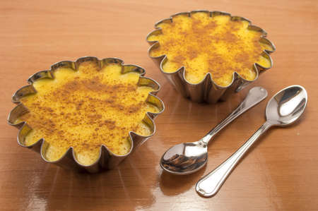 Pudding isolated in white background and spoonの写真素材